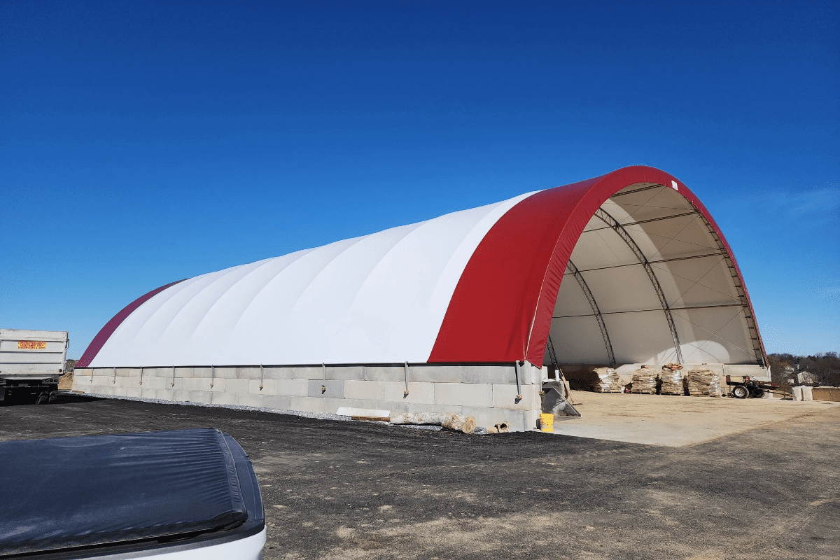 Red and white fabric-covered storage building