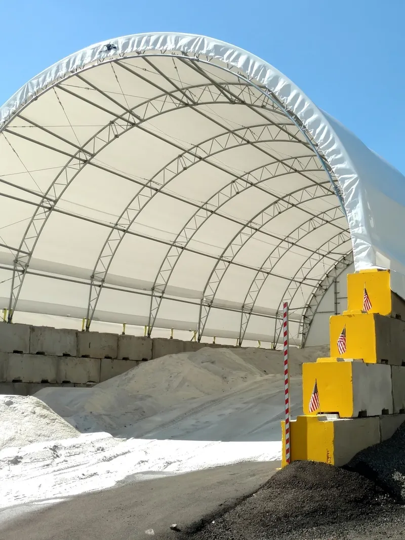 White canopy sheltering sand heap